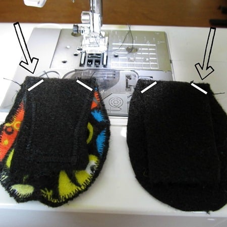 A photo of two felt and fabric eye patch pieces being sewn on a sewing machine.