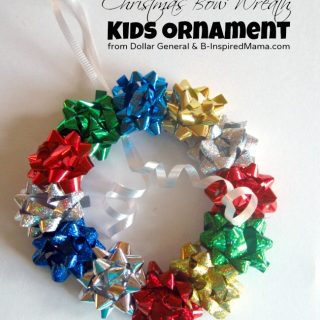 An easy preschool ornament craft made with a paper plate and Christmas bows to look like a little holiday wreath.