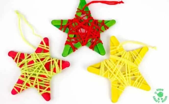 A group of 3 homemade star Christmas ornament crafts for preschoolers made using colored craft sticks shaped into stars and wrapped in colorful yarn.