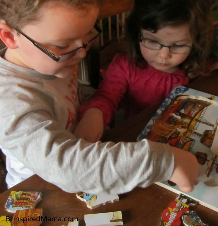 Playing with our Flipzle Wooden Puzzle at B-InspiredMama.com