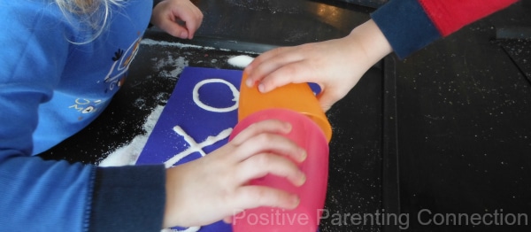 Working Together on Their Salt Painting from Positive Parenting Connection and B-InspiredMama.com