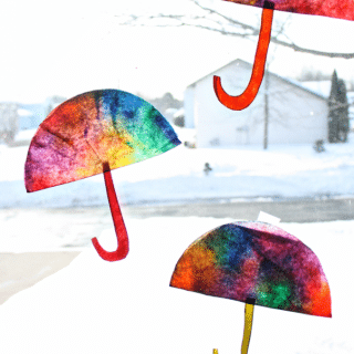 Coffee Filter Umbrella Craft from Sunny with a Chance of Sprinkles at B-InspiredMama.com