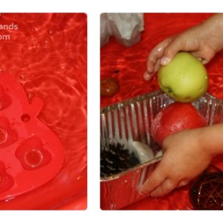 A child doing a Fall Preschool Sink or Float Experiment with various Autumn-themed objects like pine cones and pumpkins in a bin of water.