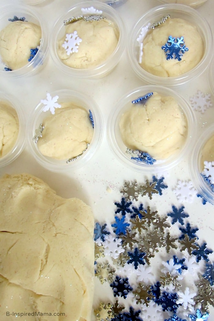 Filling Containers of Sparkle Snow Homemade Playdough Gift at B-Inspired Mama