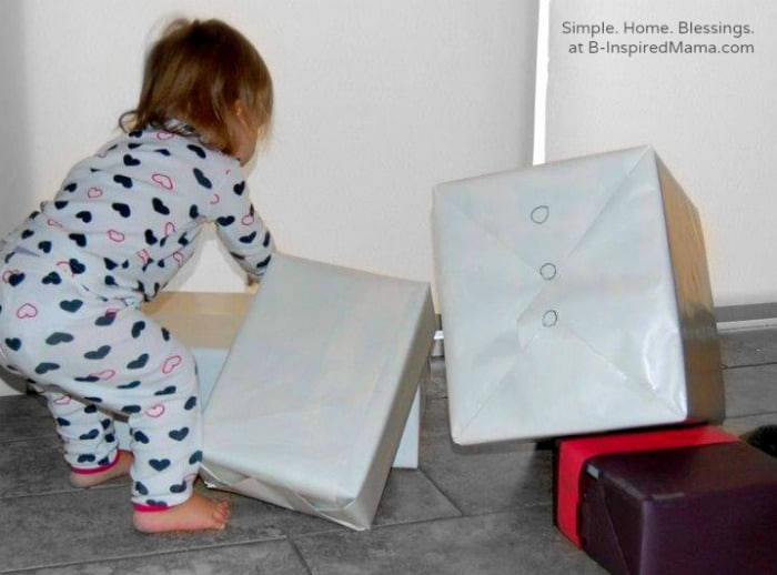 Toddler Playing with A Cardboard Box Snowman Play Set at B-Inspired Mama