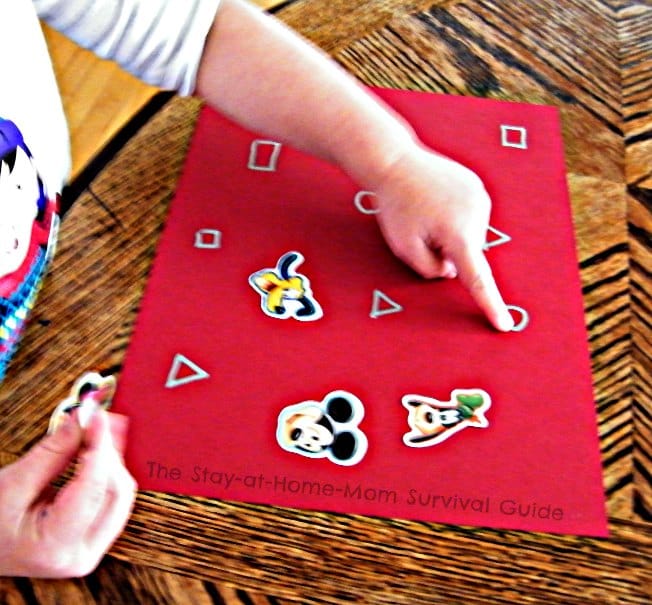 Pointing - Learning Letters and Shapes with a Simple Sticker Activity - From The Stay-At-Home-Mom Survival Guide at B-Inspired Mama
