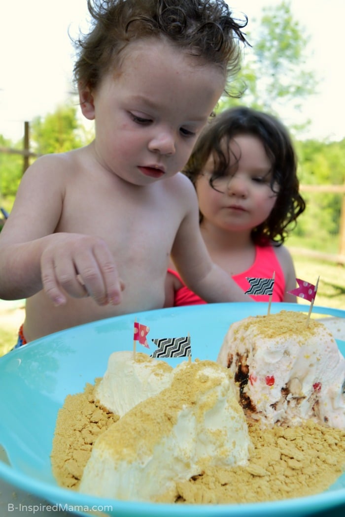 Adding Flags to Our Giant Ice Cream Sundae Sand Castle - B-Inspired Mama