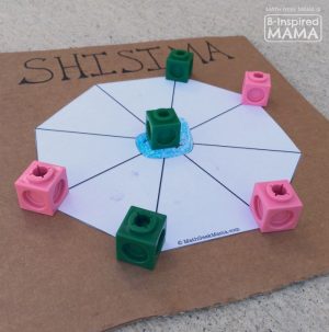 A photo of a DIY Shisima game, a cool multicultural math game from Kenya for kids.