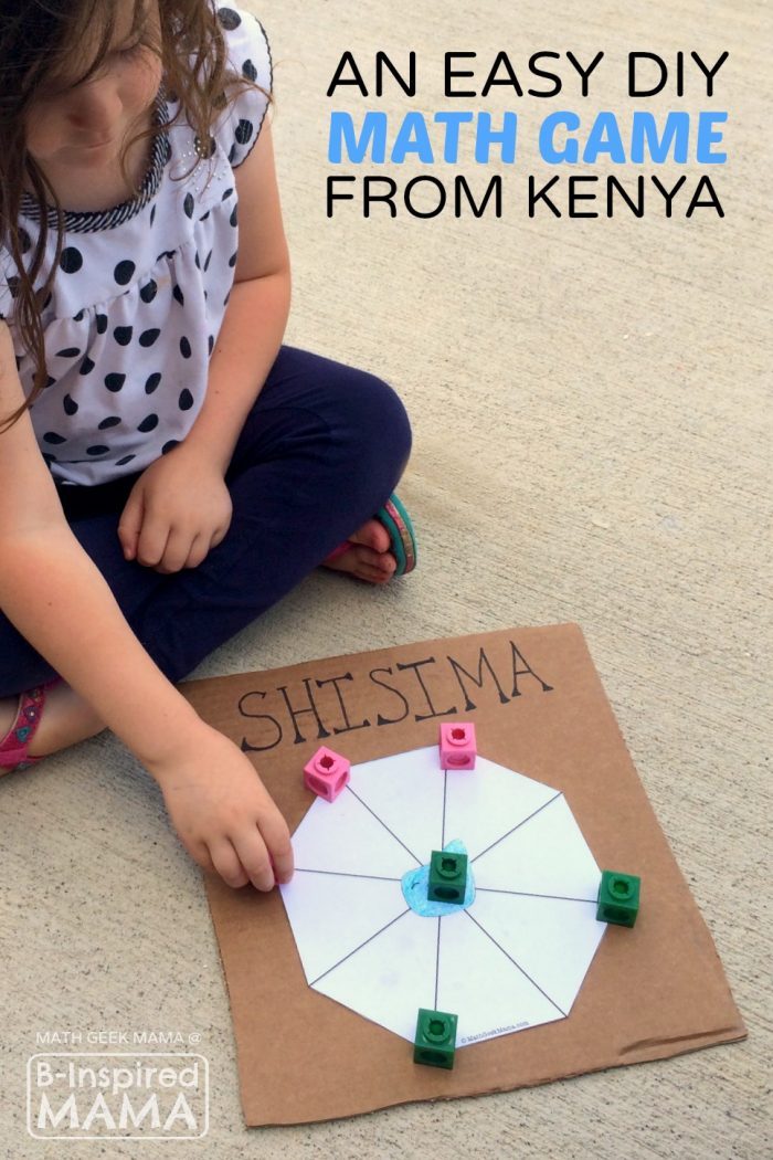 A photo of a child playing a homemade Shisima Game — a math game from Kenya. The game uses a white paper octagon shape glued onto a piece of cardboard and math counters for tokens. 