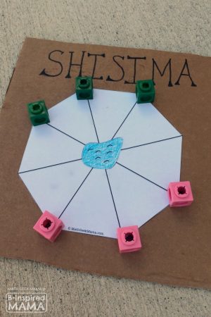 A photo of a DIY Shisima game, a cool multicultural math game from Kenya for kids.
