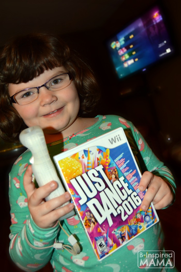 Fun Alternatives to Family Movie Night - Priscilla with her Just Dance Game - at B-Inspired Mama