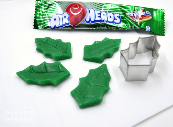 Make a Holly Cupcake Topper for Christmas Cupcakes - Using Watermelon Airheads for Holly - at B-Inspired Mama