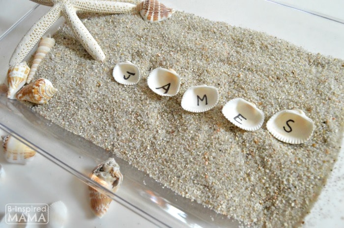 Learning the Alphabet with Seashells and Sand Sensory Writing - Learning to Spell His Name - at B-Inspired Mama
