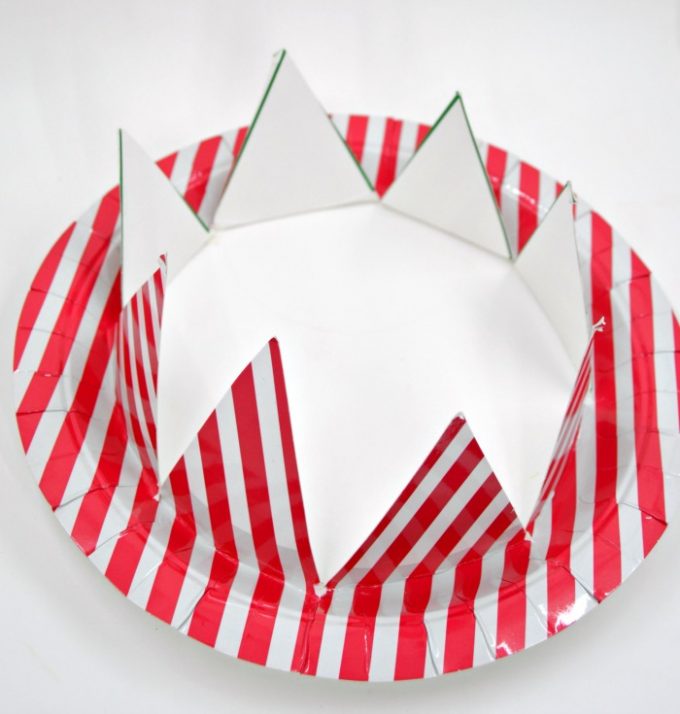 A photo of a folded paper plate crown for a 4th of July craft for preschoolers.