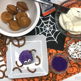 Adding Pretzel Legs - Spider Bites for a fun Halloween Snack for Kids