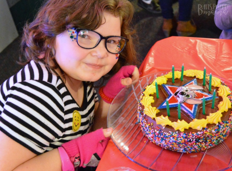 Priscilla with her cake at Chuck E. Cheese's + Birthday Traditions for Kids that are Meaningful but EASY! - at B-Inspired Mama