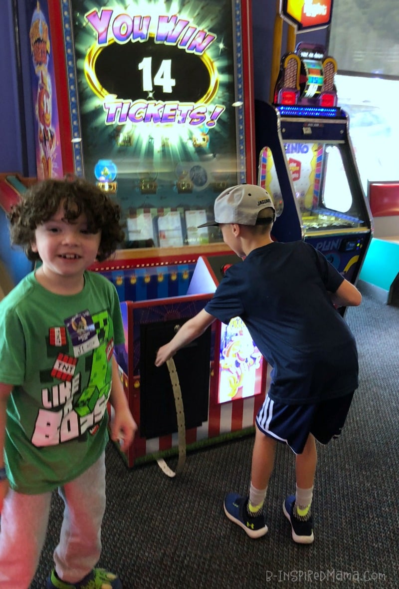 J.C. and his friend playing arcade games