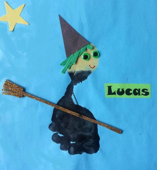 A photo of a kids Halloween footprint witch craft.