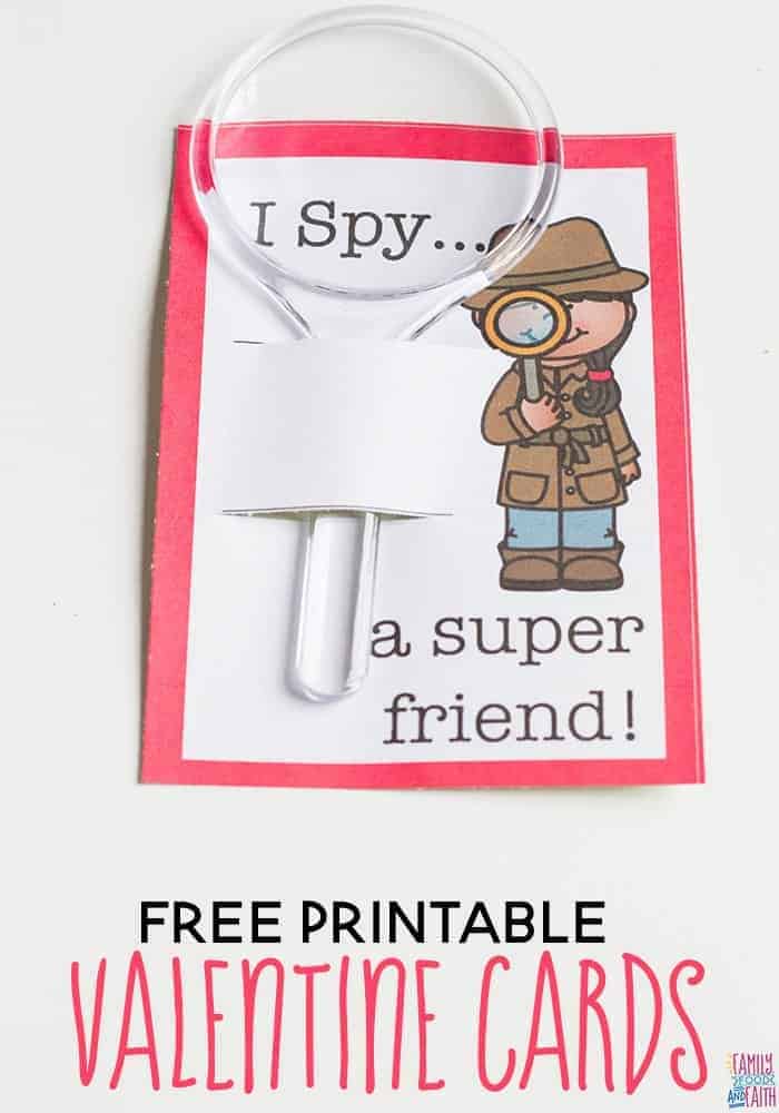 A cute printable paper I Spy Valentine with an illustration of a detective and a plastic toy magnifying glass attached to it.